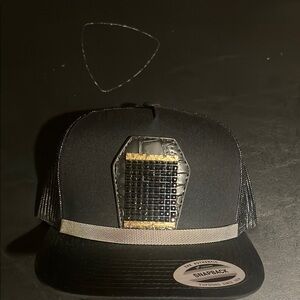 Stylish Black Snapback Hat with Gold Accent